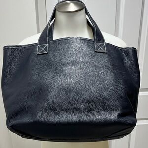 AUGUST deep navy pebble leather tote. Very good condition. Grey fabric lined.
